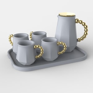May include: A light gray beverage set consisting of a pitcher and four mugs with faceted geometric bodies, each featuring a gold-colored beaded handle. The pitcher has a gold-colored lid, and all items are arranged on a matching gray rectangular tray.