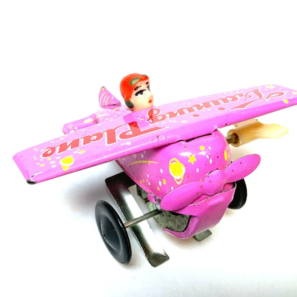 Vintage Tin Wind-Up Stunt Plane and Pilot Toy