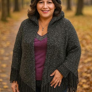 Black poncho woven on a triangular loom
