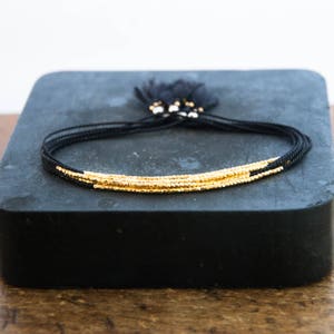 Delicate gold bracelet. Silk bracelet. Friendship bracelet. Tiny bead bracelet cord