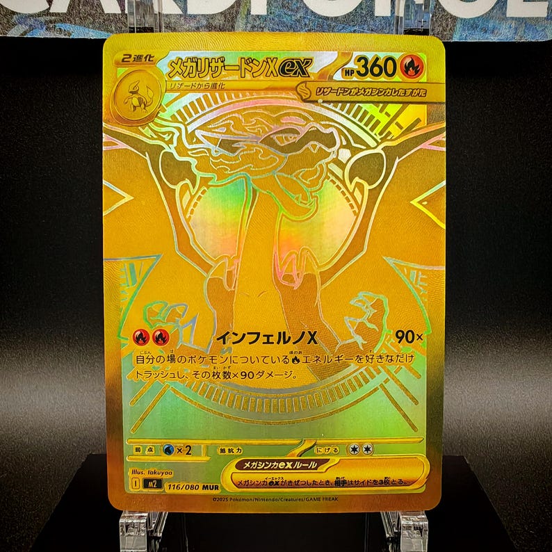 May include: A gold holographic trading card featuring a Charizard-like creature. The card has Japanese text and the number 360. The card also has the text "Inferno X" and "90x".