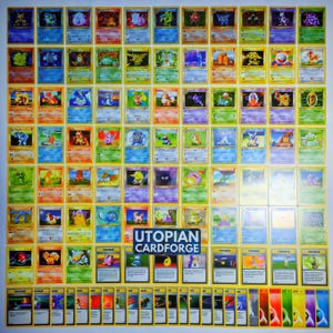 May include: A collection of numerous rectangular trading cards arranged in a grid, featuring various colourful illustrated creatures and characters with text, plus a central dark rectangular label with the white text UTOPIAN CARDFORGE.