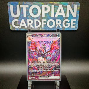 May include: A holographic Pokemon trading card featuring Charizard EX with a Tera symbol. The card has a red, white, and black design with a fiery background. The card text reads "Infernal Reign" and "Burning Darkness".