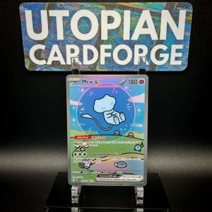 May include: A holographic Pokemon trading card featuring Mew EX. The card is blue and white with a pink and purple holographic effect. The card has a picture of Mew EX in the centre, with the text "Mew EX" and "180 HP" at the top. The card also has the text "Restart" and "Genome Hacking" at the bottom.