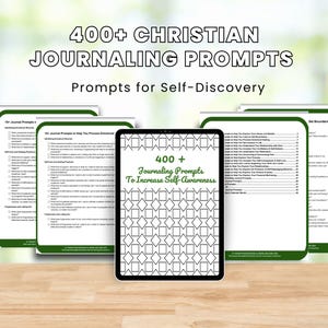 May include: A digital tablet displaying a black and white pattern with the text "400+ Journaling Prompts To Increase Self-Awareness". The tablet is surrounded by several pages of journaling prompts with green borders. The background is a blurred image of green foliage.