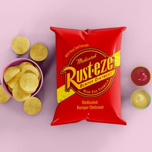 May include: A red bag of "Rust-eze Medicated Bumper Ointment" with yellow accents and text. A pink bowl of round, yellow chips and two small bowls of dips are also present. The background is a solid light purple.