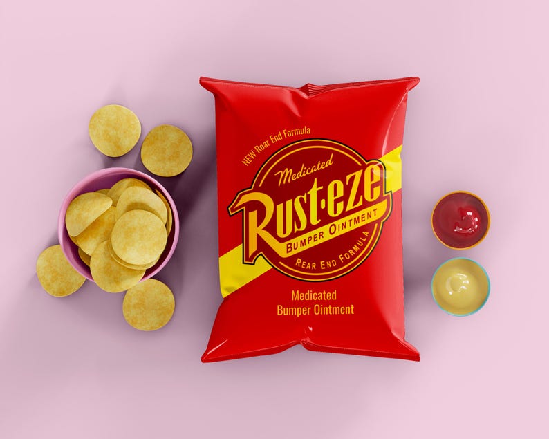 May include: A red bag of "Rust-eze Medicated Bumper Ointment" with yellow accents and text. A pink bowl of round, yellow chips and two small bowls of dips are also present. The background is a solid light purple.