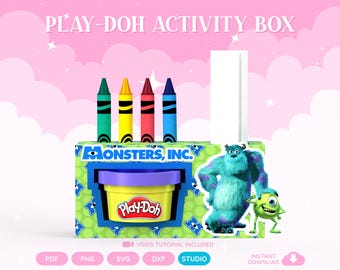May include: A Monsters, Inc. themed Play-Doh activity box featuring a yellow Play-Doh container with a purple lid, four crayons in green, yellow, red, and blue, and images of Sulley and Mike Wazowski. The box is green with blue monster eye patterns.