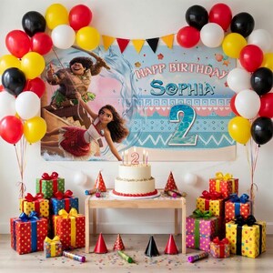 May include: A birthday party setup featuring a Moana-themed backdrop with the text Happ Birthday Sophia and a large number 2. A white cake with a number 2 candle sits on a table surrounded by colorful gift boxes and a balloon arch in red, yellow, black, and white.