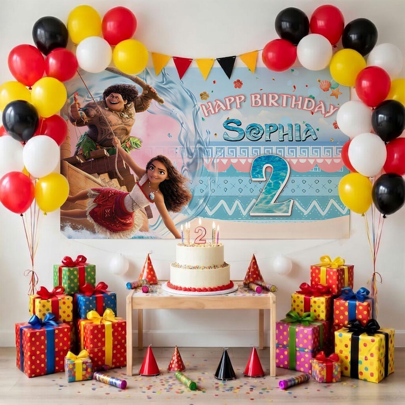 May include: A birthday party setup featuring a Moana-themed backdrop with the text Happ Birthday Sophia and a large number 2. A white cake with a number 2 candle sits on a table surrounded by colorful gift boxes and a balloon arch in red, yellow, black, and white.