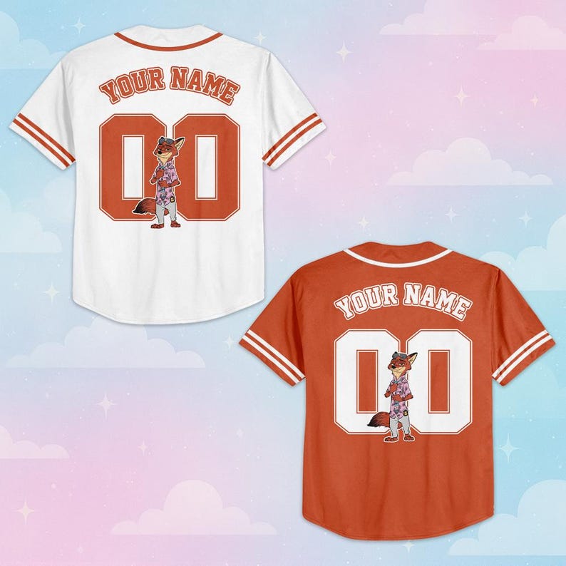 May include: Two short-sleeve baseball jerseys, one white and one orange, each featuring a cartoon fox character, the text "YOUR NAME" in an arched font, and the number "00" on the back. Both jerseys have striped trim on the sleeves and collar.