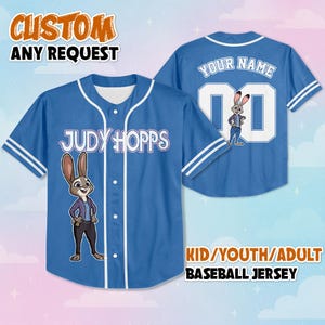May include: A blue button-up baseball jersey featuring a graphic of the character Judy Hopps on the front with her name printed above. The back displays the text YOUR NAME above the number 00 and another graphic of the same character.