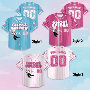 May include: Baseball jerseys in three styles: light blue, pink, and white. Each jersey features the text "GHOST SPIDER" and a number "00". The jerseys have a button-up front and short sleeves. The back of the jerseys have the text "YOUR NAME" and the number "00".