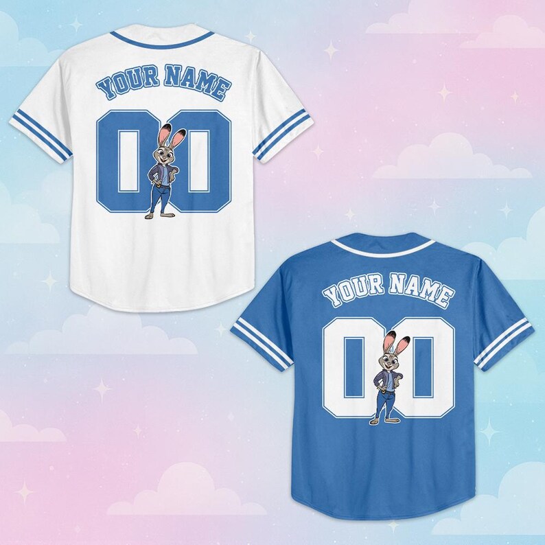 May include: Two baseball jerseys, one white and one blue, featuring the text YOUR NAME and the number 00 on the back. Each jersey displays a cartoon rabbit character standing in front of the number 00, with striped trim on the sleeves and collar.