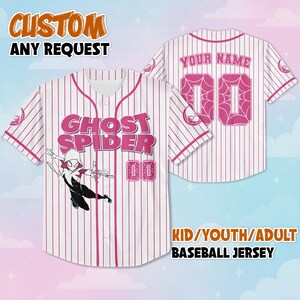 May include: White and pink pinstripe baseball jersey featuring the words "GHOST SPIDER" and the number "00" in pink. The jersey has a cartoon graphic of Ghost Spider. The text "CUSTOM ANY REQUEST" is at the top, and "KID/YOUTH/ADULT BASEBALL JERSEY" at the bottom.