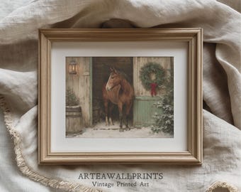 May include: Framed vintage print featuring a brown horse standing in a snowy stable doorway. A Christmas wreath hangs on the door. The print is in a light brown wooden frame. The text "ARTEAWALLPRINTS Vintage Printed Art" is at the bottom.