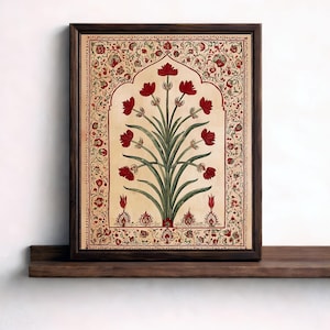 Può includere: Stampa artistica incorniciata raffigurante un motivo floreale stilizzato con fiori rossi e foglie verdi su sfondo crema. L'opera d'arte è racchiusa in una cornice marrone scuro e presenta un bordo decorativo. Il testo "ARTEA WALLPRINTS" è in basso.