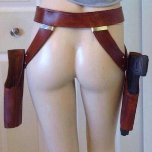 May include: A weathered wooden sign, inscribed with 'Welcome to our home' in white. The sign has a distressed appearance, suggesting a vintage aesthetic, and is suitable for a porch or hallway.