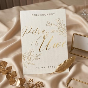 May include: A set of three ceramic mugs with a speckled, matte finish. The mugs are in shades of cream, light gray, and dark gray. Each mug has a simple, modern design and a rounded handle. The mugs are stacked on top of each other.