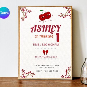 Puede incluir: Una invitación de cumpleaños enmarcada con un tema de cerezas. El texto dice "Ashley cumple 1" en escritura roja. La invitación incluye la fecha, la hora y la información de RSVP. Ilustraciones decorativas de cerezas y un lazo rojo acentúan el diseño.