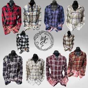 May include: Collection of plaid button-down shirts in various colors, including red, blue, black, and tan. Some shirts have a bleached or distressed look. The shirts are displayed on black mannequins. The image includes the text "Maylin's Creations Shack".