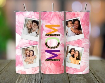 May include: Three pink stainless steel tumblers with a watercolor design and photos of mothers and children. The tumblers have the word "MOM" written on them in colorful letters with a leopard print design.