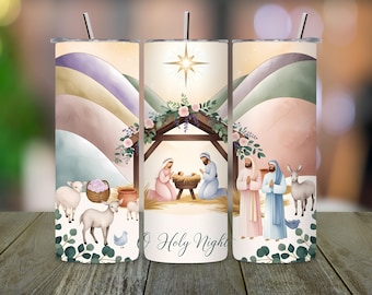 May include: A stainless steel tumbler with a watercolor illustration of the Nativity scene. The design features Mary, Joseph, baby Jesus, and animals. The words "O Holy Night" are written on the bottom.