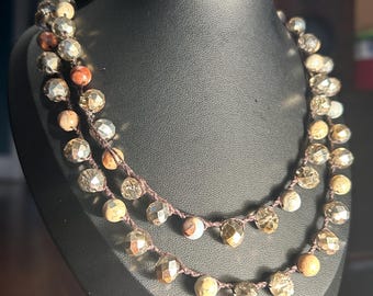 May include: A set of three ceramic mugs with a speckled, matte finish. The mugs are in shades of cream, light gray, and dark gray. Each mug has a simple, minimalist design, perfect for coffee or tea.
