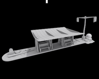 May include: A miniature, light gray model of a bus stop shelter with benches, a roof, and a street light. The shelter has a wooden design, and the scene includes small details like rocks and a small structure.