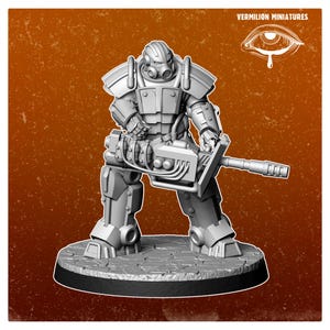 May include: A gray miniature figure of a futuristic soldier in power armor, holding a large weapon. The figure is standing on a textured base. The image includes the text "VERMILION MINIATURES".