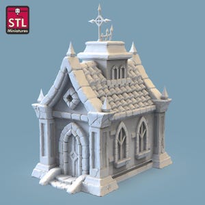 May include: A white 3D printed model of a small stone building with a pointed roof, a door, two windows, and a cross on top. The building has a textured surface and appears to be a chapel or mausoleum.