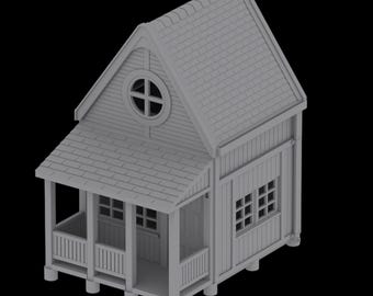 May include: A gray miniature house with a porch, a shingled roof, and a round window with a cross design. The house has multiple small windows and a detailed exterior.