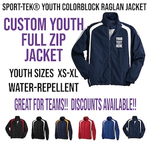 May include: A navy blue youth full zip jacket with white colorblock raglan sleeves. The jacket is water-repellent and has a zipper closure. The text "YOUR TEXT HERE" is printed on the front of the jacket. The jacket is available in youth sizes XS-XL.