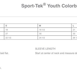 May include: Size chart for a youth colorblock raglan jacket. The chart shows chest width, sleeve length, and body length at back measurements in inches for sizes XS, S, M, L, and XL.