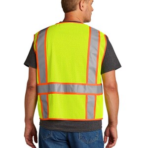 May include: A yellow safety vest with orange and silver reflective strips. The vest is made of a mesh material and has a zipper closure.