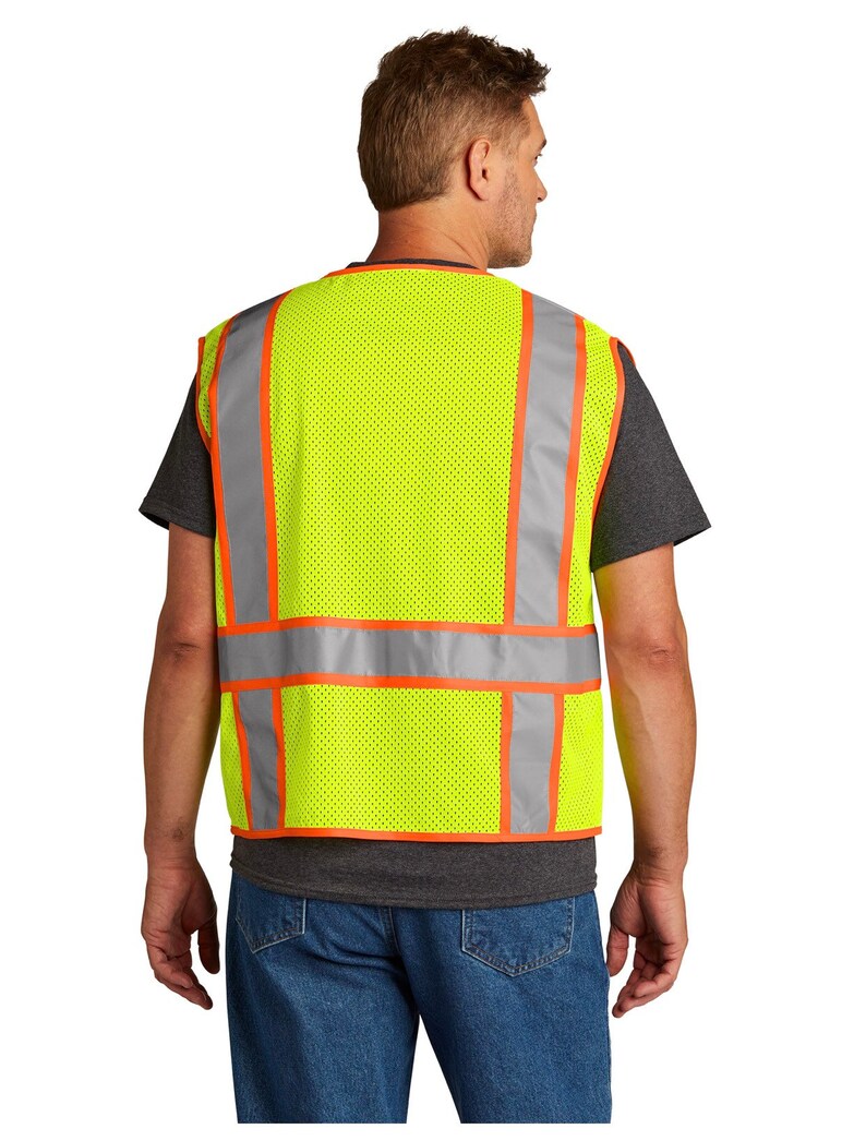 May include: A yellow safety vest with orange and silver reflective strips. The vest is made of a mesh material and has a zipper closure.