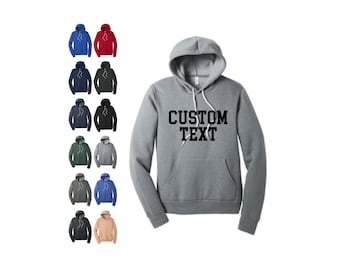 May include: A heather grey hooded sweatshirt with a black print that says "CUSTOM TEXT". The sweatshirt is available in a variety of colors.