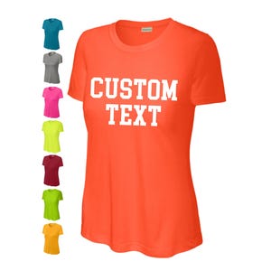May include: Orange t-shirt with white text that says "CUSTOM TEXT".