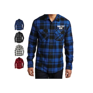 May include: A blue and black plaid flannel shirt with a patch on the left chest that says "YOUR TEXT HERE". The shirt is shown in multiple colors, including red, black, and white.