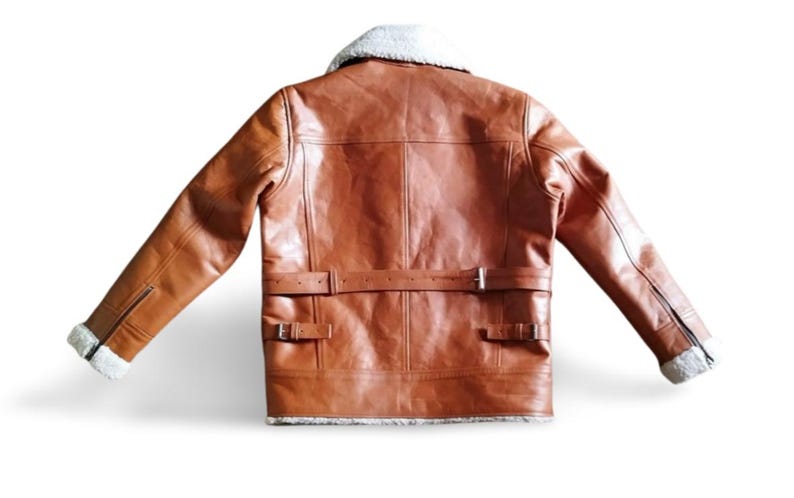 100% Genuine Leather: Premium cowhide/sheepskin leather for a luxurious look & feel.  Soft Shearling Fur Lining: Thick, warm, and breathable faux/sheepskin fur for extreme winter conditions. Classic Aviator Bomber Design: Inspired by WWII pilot jackets, offering a rugged, vintage vibe.  Custom Size Available: Need a perfect fit? Send us your measurements for a tailor-made jacket.  Ideal for Bikers & Riders: A motorcycle-friendly leather jacket, designed for comfort & durability.
