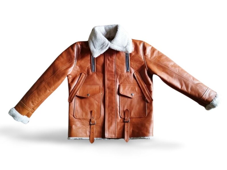 100% Genuine Leather: Premium cowhide/sheepskin leather for a luxurious look & feel.  Soft Shearling Fur Lining: Thick, warm, and breathable faux/sheepskin fur for extreme winter conditions. Classic Aviator Bomber Design: Inspired by WWII pilot jackets, offering a rugged, vintage vibe.  Custom Size Available: Need a perfect fit? Send us your measurements for a tailor-made jacket.  Ideal for Bikers & Riders: A motorcycle-friendly leather jacket, designed for comfort & durability.