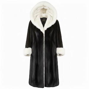May include: A long black coat with a white fur-lined hood and cuffs. The coat has a button closure and a white trim down the front. The coat is made of a soft, luxurious material.