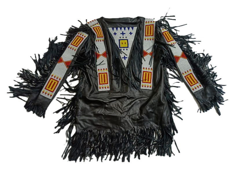 May include: A black leather jacket with fringe detailing and colourful beaded trim. The jacket has a V-neck and long sleeves.