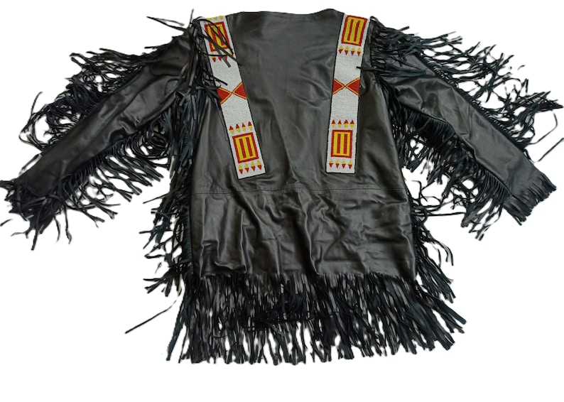 May include: Black leather jacket with fringe detailing and beaded trim. The trim features red, yellow and white accents.