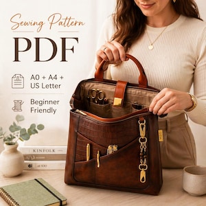 May include: A brown leather tote bag with a crocodile texture, open to reveal pockets and sewing tools. The bag has a handle and a gold-colored clasp. Text on the image reads "Sewing Pattern PDF" and "Beginner Friendly".