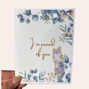 I'm Proud of You – A2-wenskaart voor aanmoediging met bloemdessin en hondillustratie