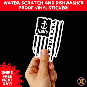 May include: A white vinyl sticker with a distressed American flag design, featuring an anchor and the word "NAVY." The word "VETERAN" is printed vertically. The sticker is held against a black background. Text at the top reads "WATER, SCRATCH AND DISHWASHER PROOF VINYL STICKER!"