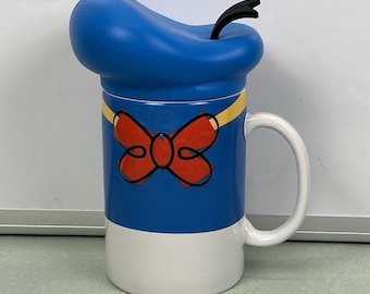 Tazza da caffè in ceramica da 473 ml (16 oz) con Paperino e cappello in silicone, tema Disney Parks.