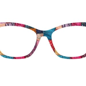 May include: Cat-eye style eyeglasses with a colorful patchwork pattern. The frames feature a mix of blue, pink, red, and yellow fabric squares. The glasses have a bold, modern design, perfect for adding a pop of color to any outfit.