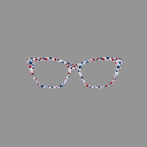 May include: Cat-eye style eyeglasses with a white frame covered in red, white, and blue stars. The glasses have a retro design and are set against a gray background. These glasses are a patriotic accessory.
